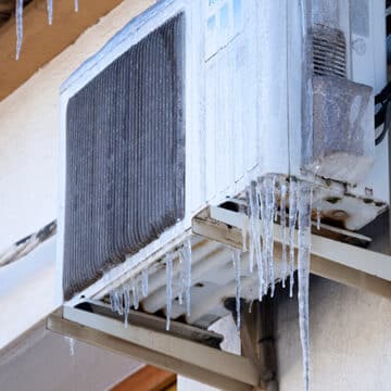 Why Is My Heat Pump Freezing Up? A heat pump covered in ice.